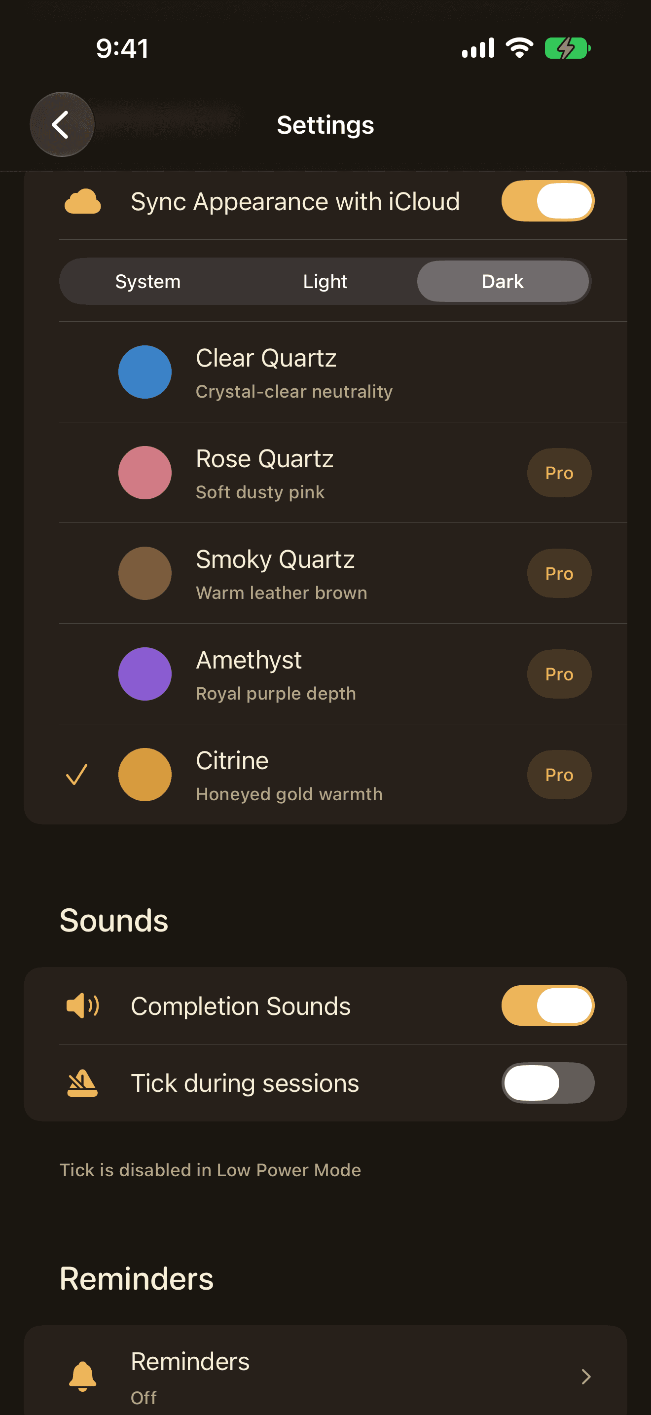 The Quartz theme picker on iPhone showing the five gemstone themes as coloured swatches