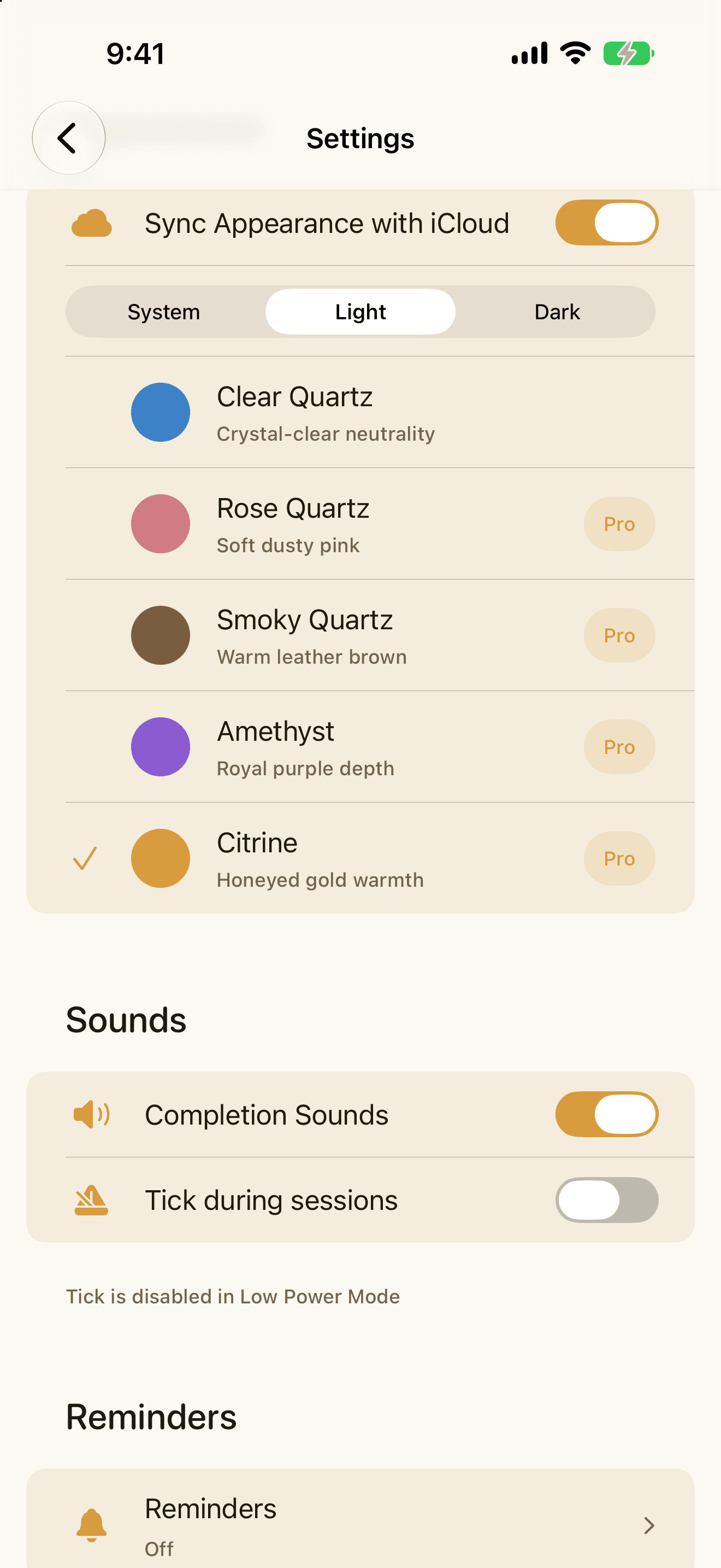 The Quartz theme picker on iPhone showing the five gemstone themes as coloured swatches